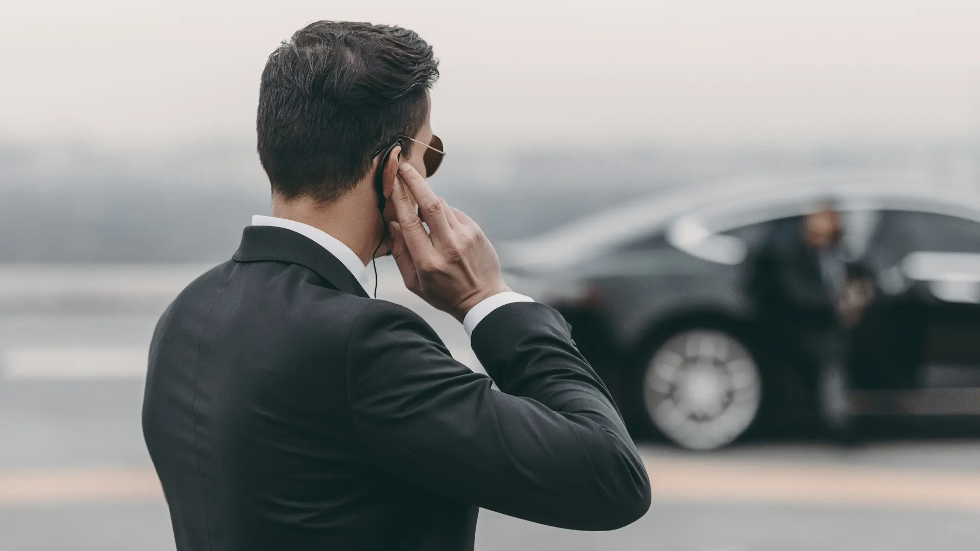 Close protection agents coordinating secure transfer in Zurich